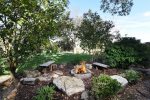 The wood fire pit is the perfect spot to relax with friends and family